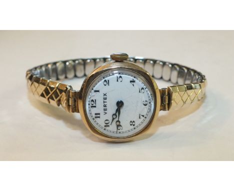 A ladies 9ct-gold-cased Vertex wrist watch on plated expanding bracelet.