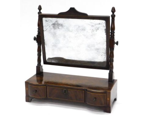 An early 19thC mahogany and boxwood strung dressing table mirror, rectangular plate, on part turned supports, the box base wi