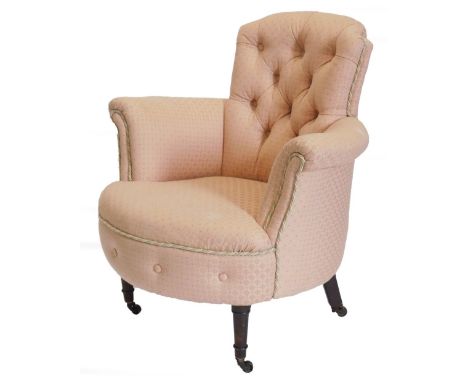 A Victorian mahogany tub shaped chair, with a button padded back, arm rest and seat, upholstered in pink and gold fabric with