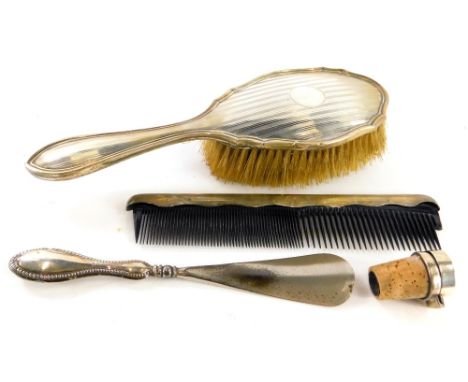 Various silver mounted items, to include a shoe horn, a bottle stopper, a brush and a comb.