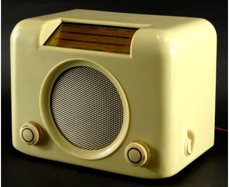 A vintage cream coloured Bakelite Bush radio, type DAC90A in fitted case with circular speaker and two tuning knobs, 25cm hig