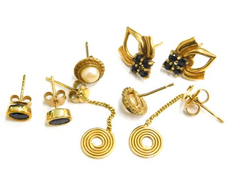 Four pairs of 9ct gold earrings, comprising a pair of modern circular drop design earrings, a pair of sapphire set studs, a p