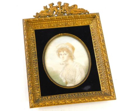 After Reynolds.  Oval portrait miniature of a lady wearing bonnet, watercolour hightened in white, 12cm x 9cm, in an elaborat