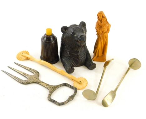 Bygones and collectables, an early 20thC Black Forest bear, thimble box, the carved beast seated, 9cm high, a carved figure o