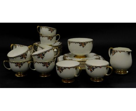 A Carltonware part tea service, decorated with flowers, embellished with coloured enamel jewel work, in turquoise, yellow and