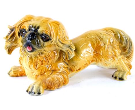 A Goebel ceramic large model of a Pekingese dog, printed marks in blue to underside, 31cm long.