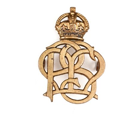 A cap badge of Paget’s Massage Service. GC          Plate 2