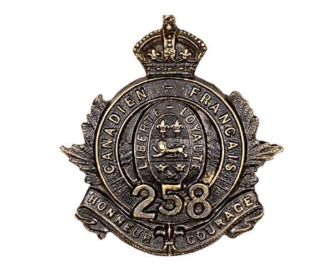 A similar cap badge of the 258th Bn, of non voided blackened brass. Near VGC. Plate 3