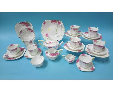 A Shelley Pink Poppey tea service, pattern No. 12226, comprising six trios, tea pot, two cream jugs, bread plate, sugar bowl 