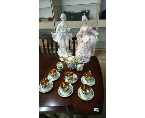 A Capo Di Monte tea service and a pair of figures