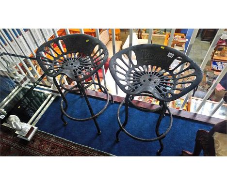 A pair of tractor seats