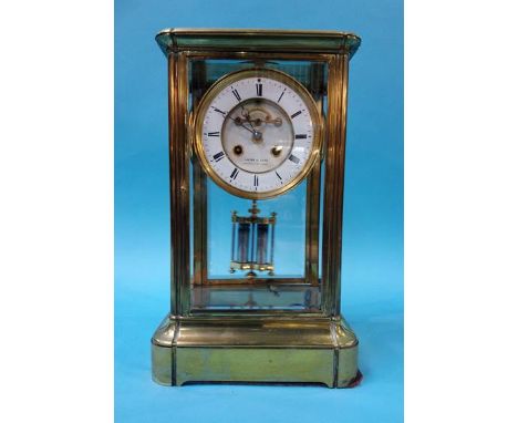 A large brass and four glass mantle clock, the dial signed 'Lister and Sons Newcastle on Tyne', 36cm x 22cm x 17cm, movement 