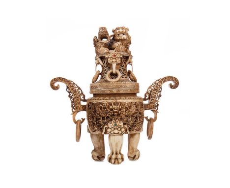 UNUSUAL CHINESE CARVED BONE CENSER,twin-handled with loop suspensions, the lid with Fo Dog finial above taotie masks, the bod