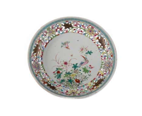 CHINESE 18TH CENTURY RETICULATED DISH,decorated in polychrome enamels with exotic bird amongst arrangement of blossoming flow