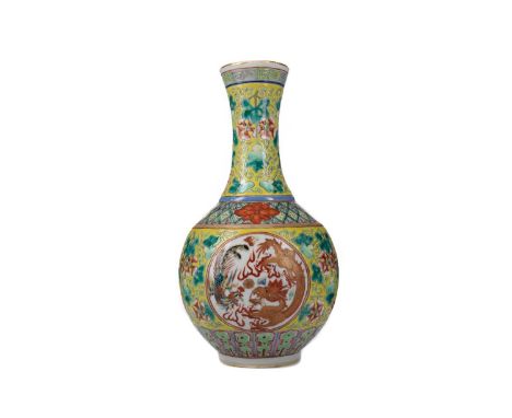 20TH CENTURY CHINESE FAMILLE JAUNE VASE,decorated with panels of phoenix and dragon chasing the sacred pearl against lotus bl