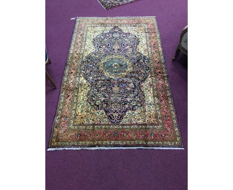 MAHAL RUG,with stylised floral scrolls on navy, cream and salmon ground, 210 x 130cmCondition report: Some light wear overall