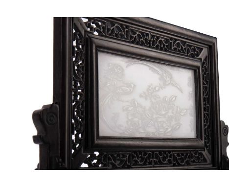 CHINESE CELADON JADE PANEL,carved in low relief with exotic birds amongst a peony bloom, four character inscription to right 
