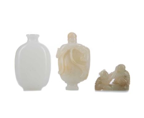 CHINESE JADE SNUFF BOTTLE,carved in relief with chilong, 7cm high, along with another snuff bottle and a carving of two figur