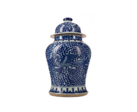 CHINESE BLUE AND WHITE PHOENIX JAR,late 19th century, of inverted baluster form, decorated with two phoenix against floral sc