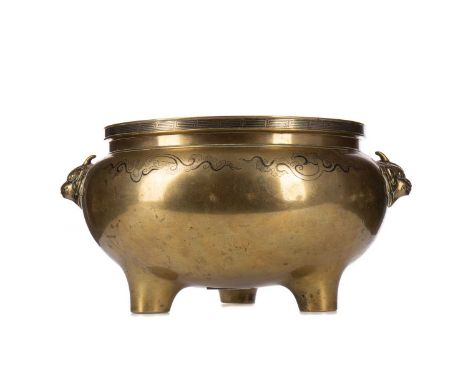 LARGE CHINESE BRONZE TRIPOD CENSER,polished finish, with key fret rim above inlaid niello-type clouds and twin beast mask han