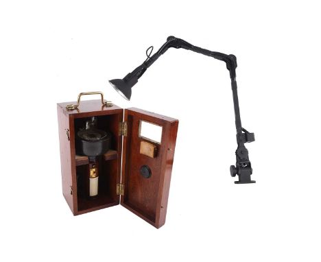 A matt black anglepoise lamp, purportedly a military aircraft navigator's lamp (possibly from an AVRO Lancaster?), stamped se