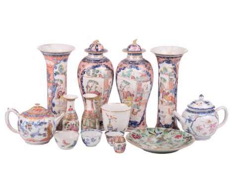 A Chinese Famille Rose porcelain bullet teapot and cover, Qianlong, late 18th century, painted with reserves of colourful flo