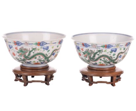 A matched pair of Chinese "Dragon and Phoenix" porcelain woucai bowls, Republic or later, typically decorated with rampaging 