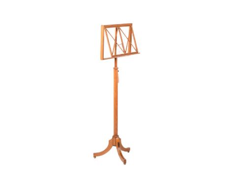 An early 20th-century oak and ebony strung music stand by Liberty's, the adjustable rectangular stand on an adjustable octago