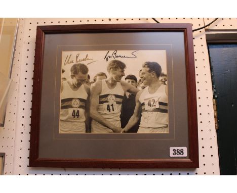 Personally signed by Roger Bannister, Chris Chataway and Chris Brasher a 4 minute mile photographth as he crosses the line. F