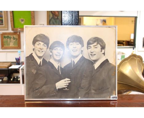 Chrome Framed Photographic print of the Beatles signed in Ink 