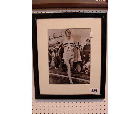 Personally signed by Roger Bannister a 4 minute mile photograph as he crosses the line. Framed and glazed measuring 32cm by 3