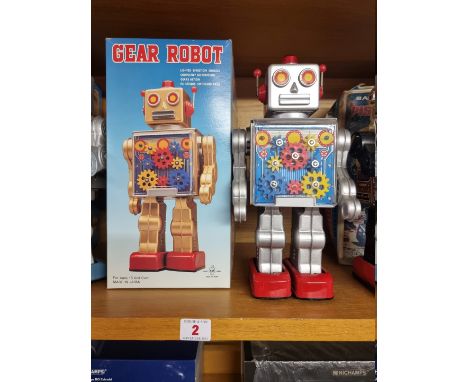 Robots:&nbsp;a vintage battery operated Made In Japan 'Gear' robot with original box. 