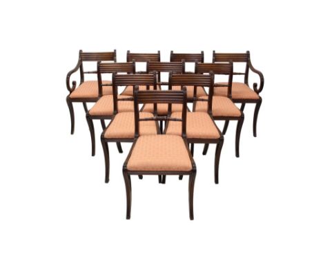 Set of ten Regency mahogany dining chairs, each with reeded top rail puce silk upholstered drop-in seats on sabre legs, to in