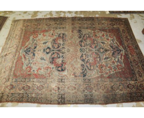 Antique Kashan rug with central concentric medallion on brick-red ground and multiple meander borders, signature panel to one