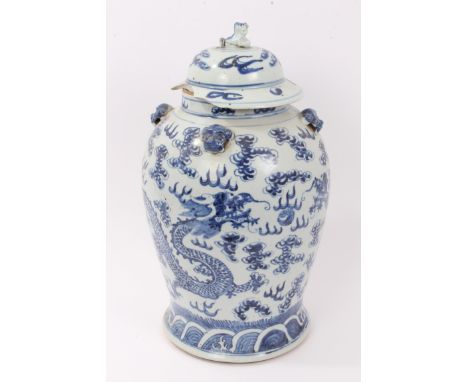 19th Century Chinese blue and white baluster vase and cover with lion knop and lion-head bosses, painted dragons chasing pear