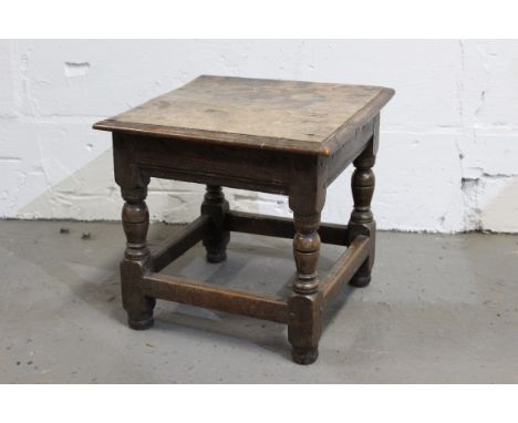 17th century and later oak joint stool with square moulded top on turned and block understructure, converted from an upholste
