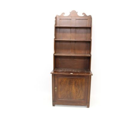 19th century mahogany and grained waterfall bookcase with scrolling top rail and graduated open shelves, enclosed panel cupbo