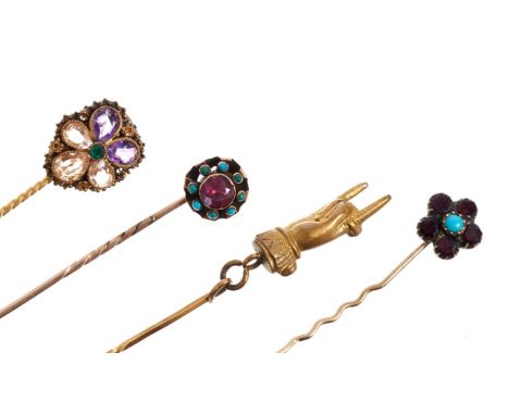 Four Regency / early Victorian stick pins – to include a gold cannetille work flower-head stick pin set with emerald, amethys