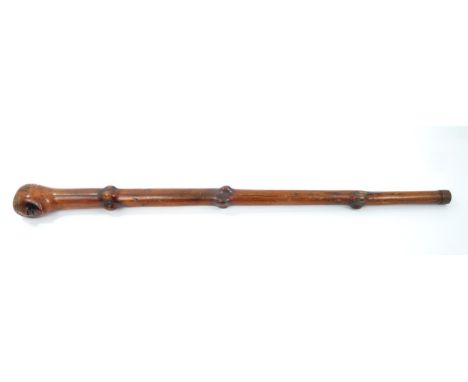 Highly unusual 19th century carved yew wood walking stick / knobkerrie, tapering stick with carved head terminal, signed with