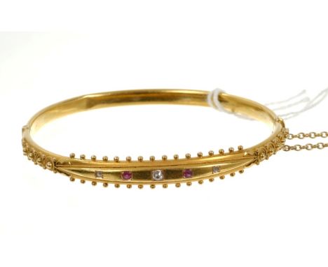 Victorian 15ct gold hinged bangle with rubies and diamonds and applied gold beaded decoration. Birmingham 1898. Good conditio