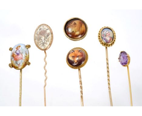 Five antique stick pins to include a Victorian polychrome enamel Fox head stick pin, George III stick pin, three other stick 