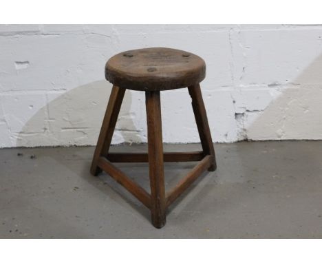 Antique Welsh oak, pine and elm rustic stool with circular seat on three legs joined by stretchers, 31cm diameter x 45cm high