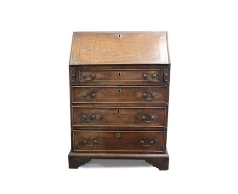 George III oak bureau of small proportions, with fall-front and four long graduated drawers with brass swan-neck handles, on 