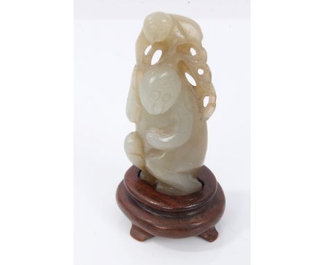 Late 19th / early 20th century jade group, carved as a standing animal, carrying a baby, 6cm high 