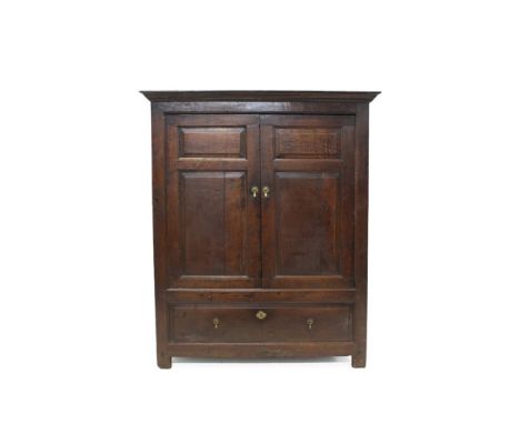 18th century oak livery cupboard, with good patination, hanging space enclosed above by pair of fielded panel doors with faux