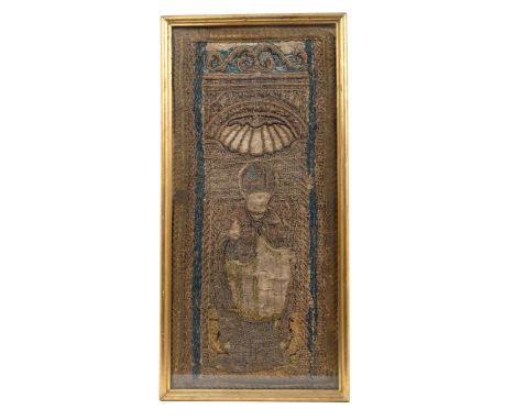 Very early Continental tapestry fragment, worked in coloured and gilt threads with depiction of a Bishop within niche surroun