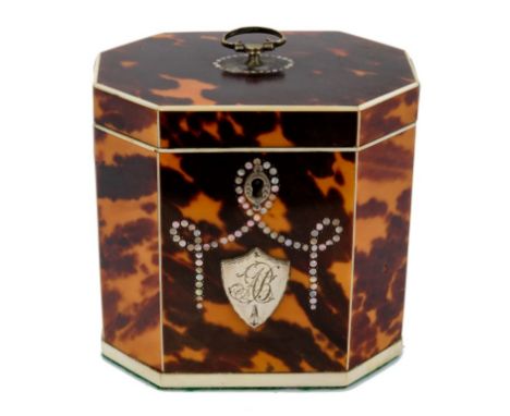 Good George III tortoiseshell tea caddy, of canted form with surmounting swing handle and mother of pearl and silver shield i