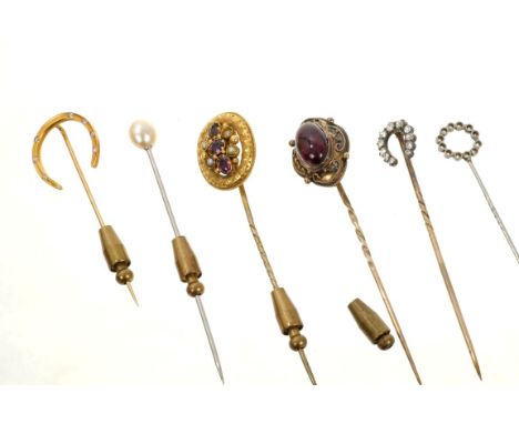 Group of six antique stick pins to include a Tiffany &amp; Co. gold and diamond horseshoe stick pin, Victorian diamond horses