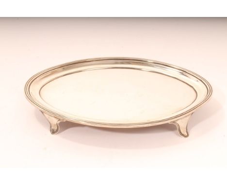 George III silver oval teapot stand with reeded border on four bracket feet (London 1797). Henry Chawner &amp; Jno Eames. All