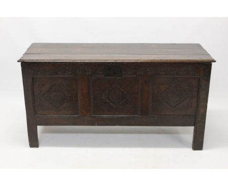 Good 17th century oak coffer with lunette carved frieze and three lozenge carved panel front on high stiles, 125cm wide x 45c